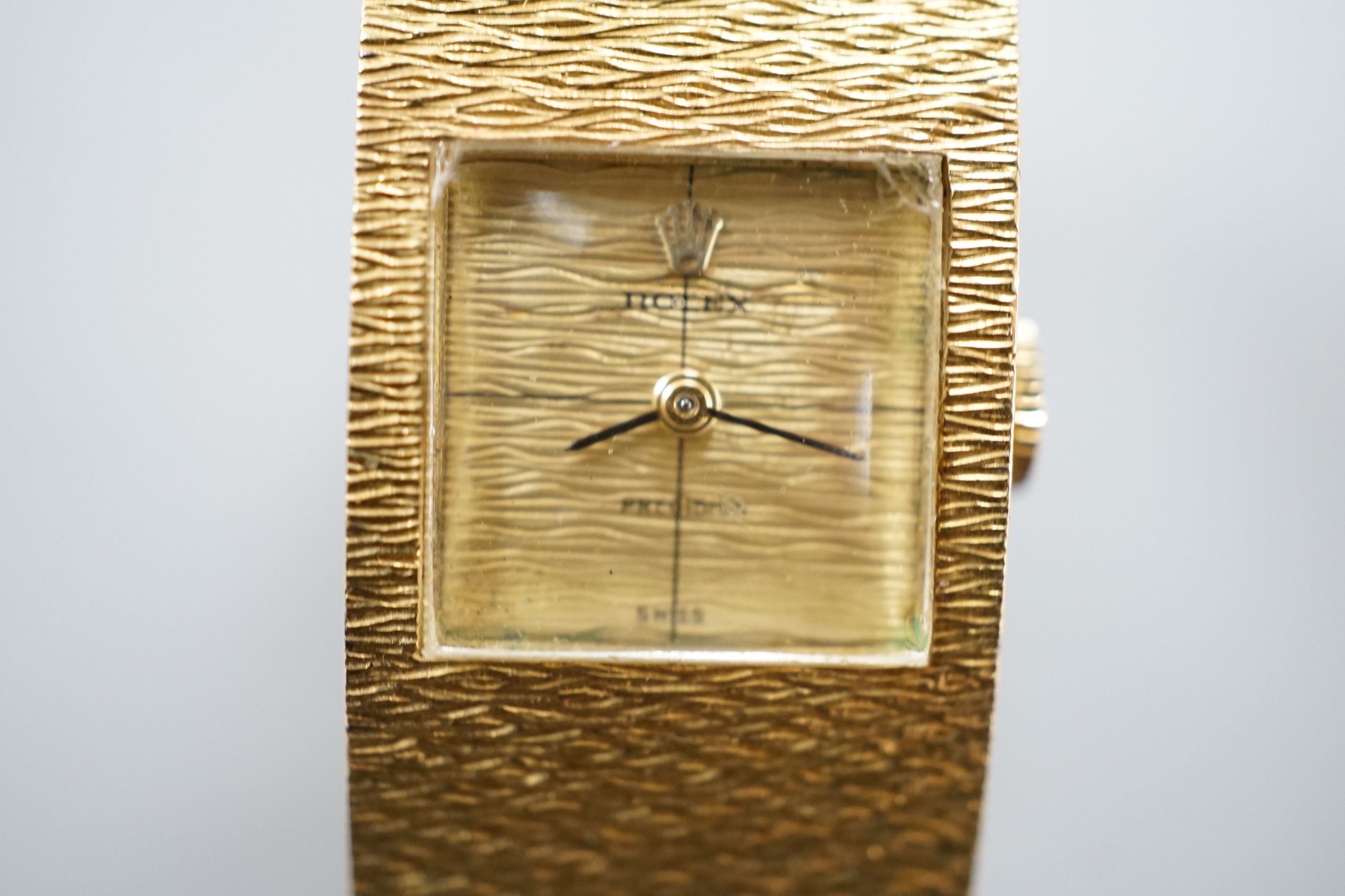 A lady's 1960's textured 18ct gold Rolex Precision manual wind bracelet watch, case diameter 17mm, gross weight 70.3 grams, with Rolex box, no papers.
